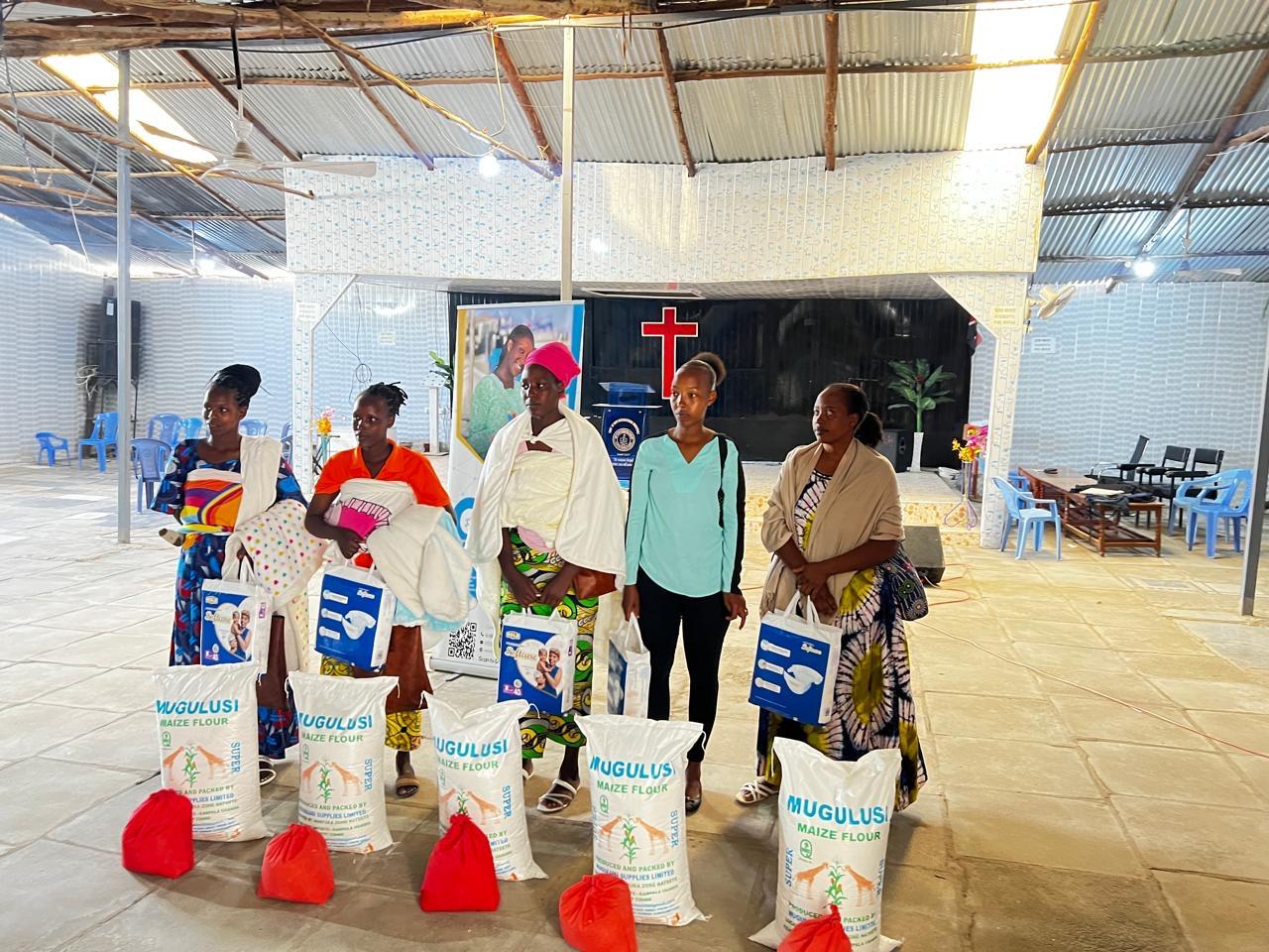Sebineza Care Organization distributing food supplies and maternal care items to refugee women with newborn babies in Githurai Kenya.